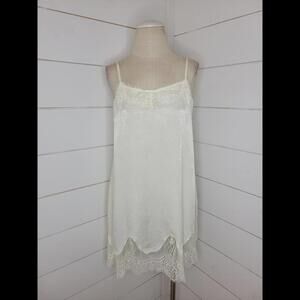 NWT Boutique Oddy cream mini slip with lace accents
